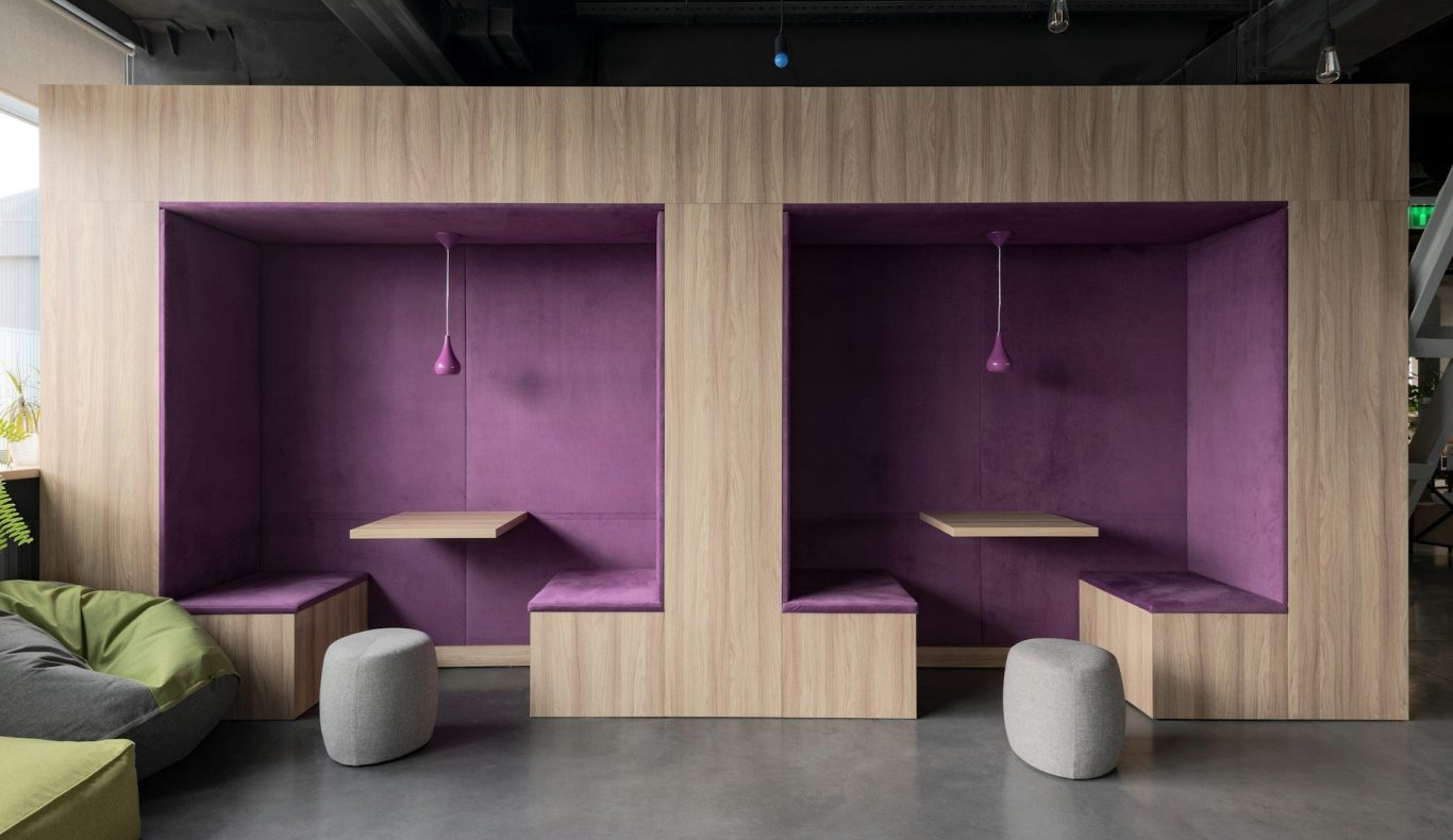 Two purple seating alcoves with small shelves and pendant lights.
